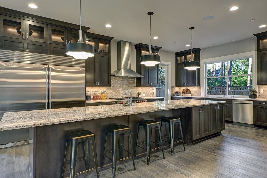 stainless steel bar stools beside counter