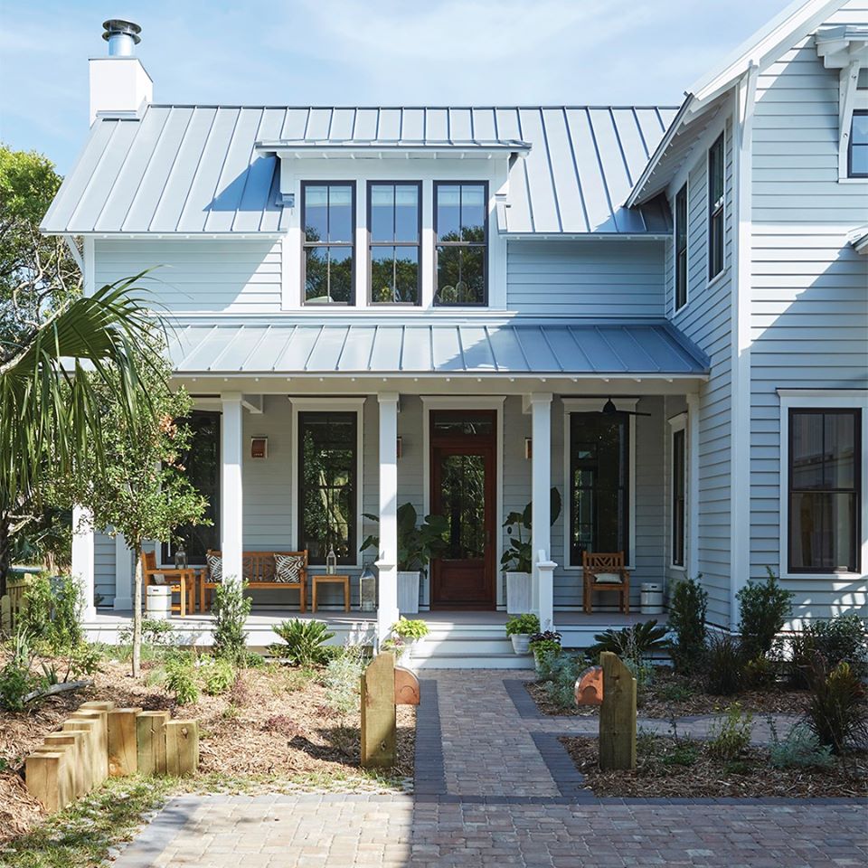 an exterior photo of a two story house with a front porch