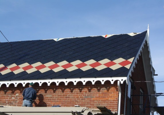black tin roof with red and beige pattern