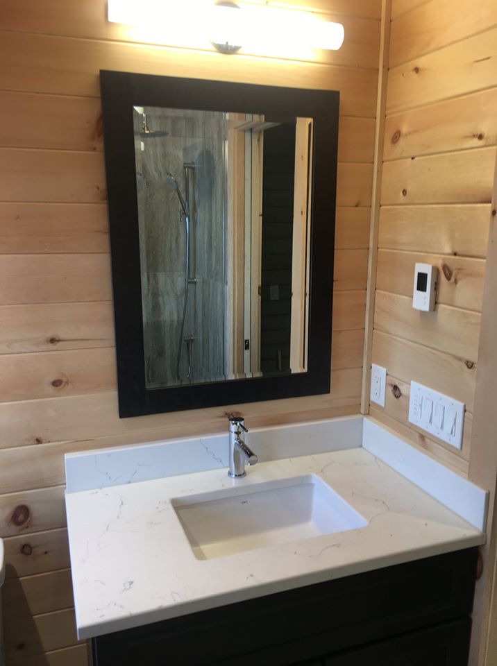 white ceramic sink with stainless steel faucet