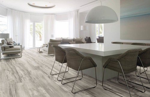 a white kitchen table with four dining room chairs