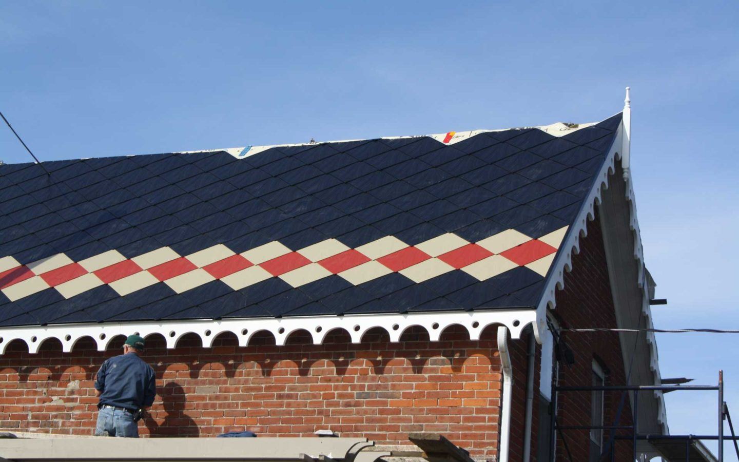 black tin roof with red and beige pattern